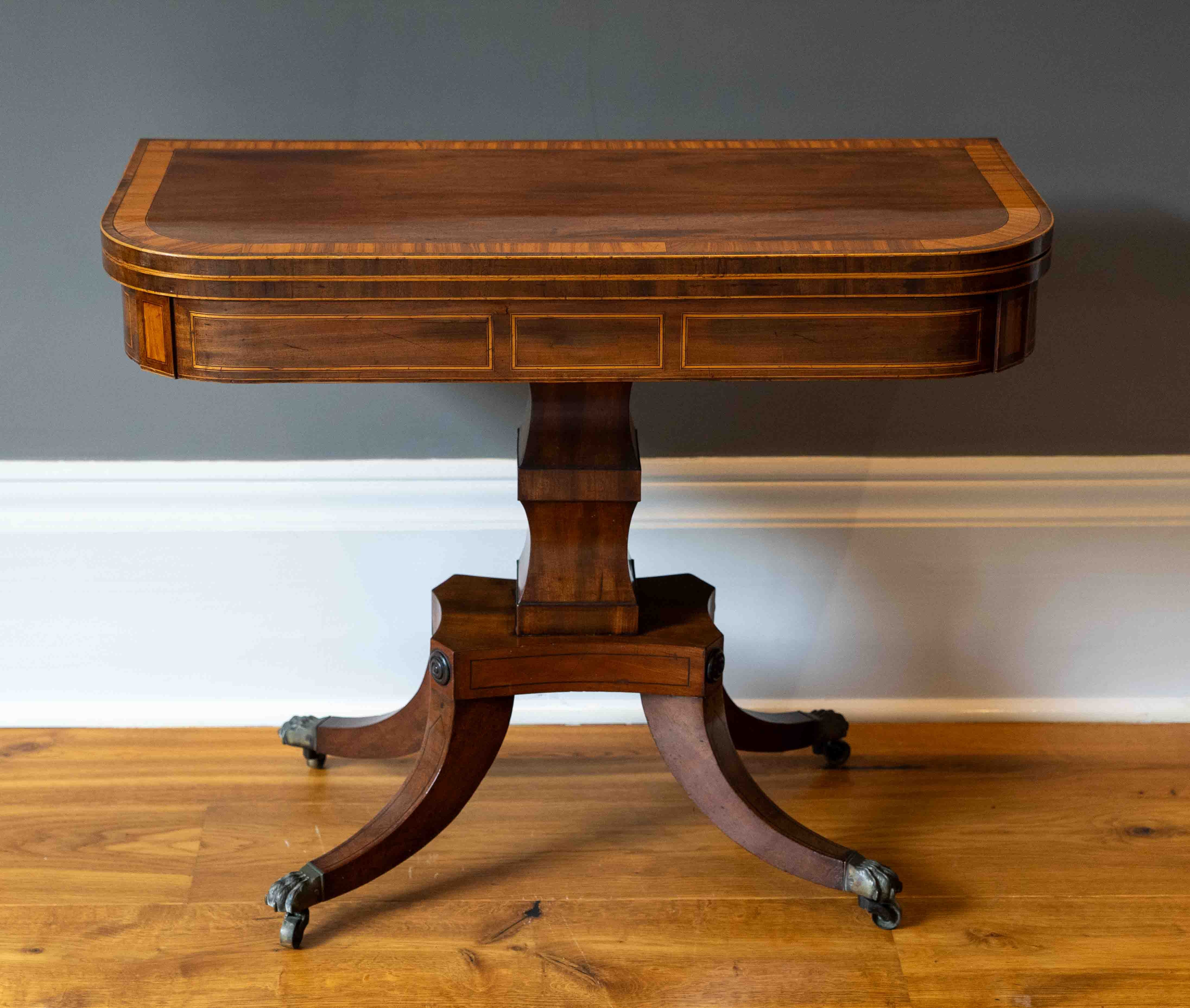 A George IV satinwood banded mahogany D shaped folding card table, width 90cm, depth 44cm, height 72cm. Condition - good